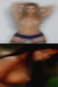 Tanned woman of nude n tattooed.